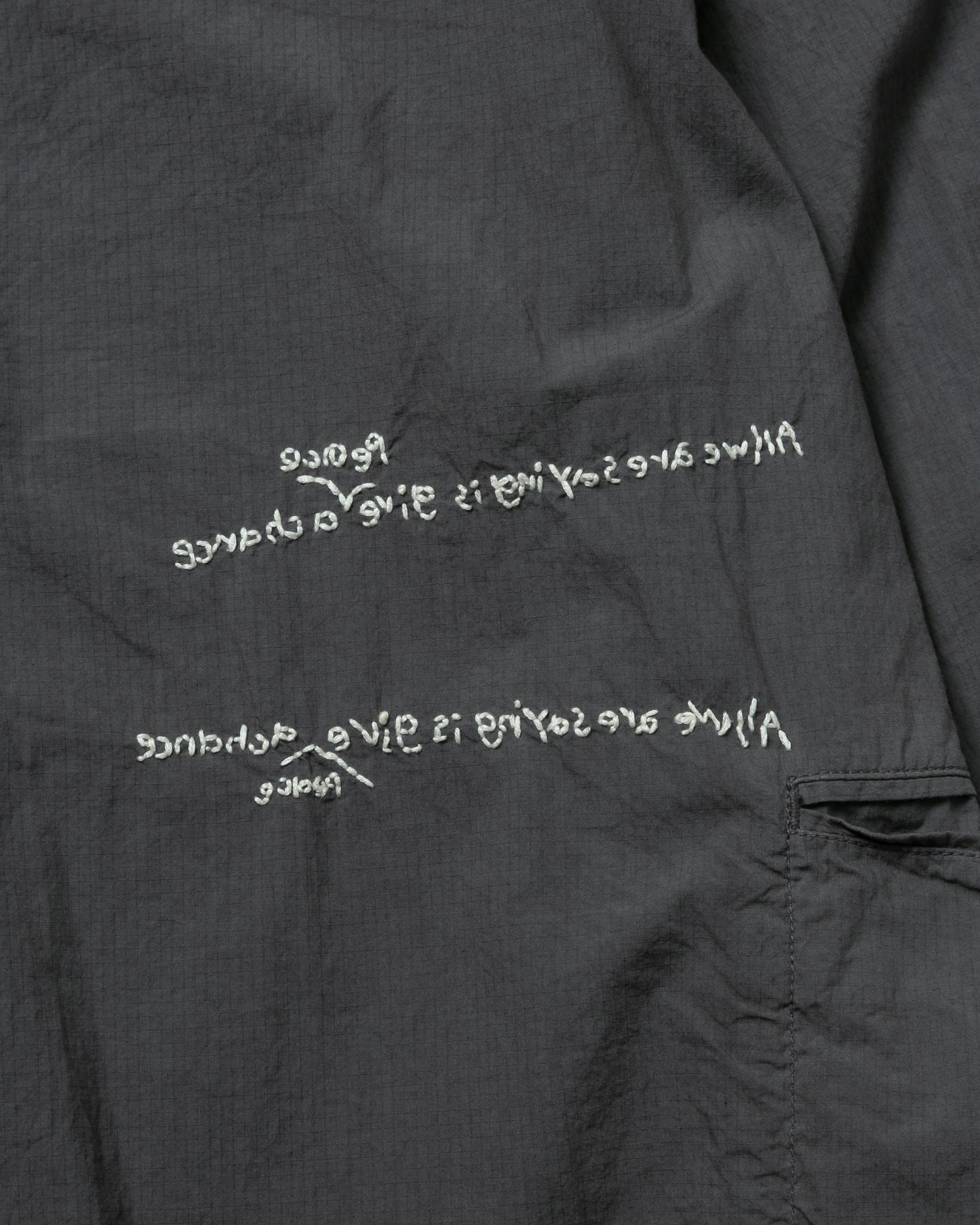 HAND-EMBROIDERED MESSAGE SHIRT (LIMITED)